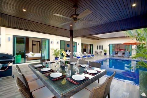 Moonstone Villa with 6 bedrooms sleeping 14 guests and offering large inside and outside dining tables, swimming pool and spacious sun deck, adjacent to the gas BBQ, ideal for Al Fresco evening dining