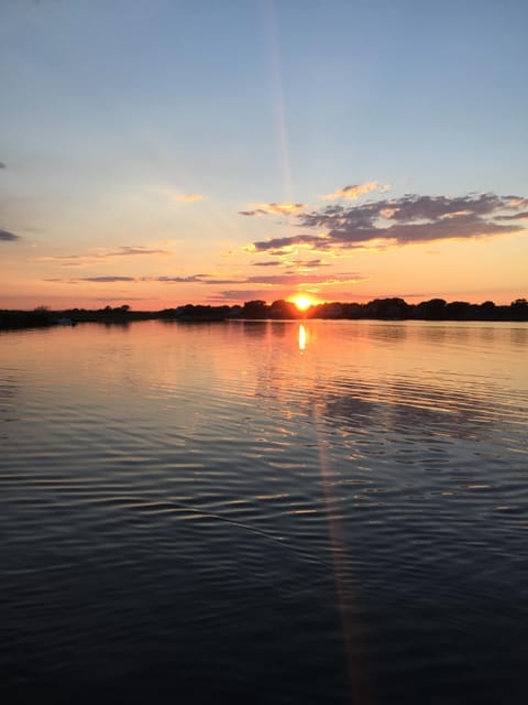 sunset view from back deck over pond
