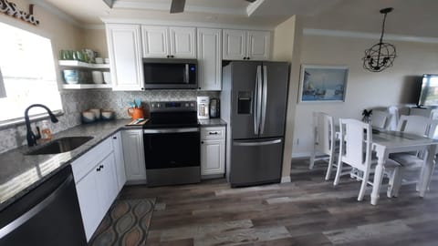 Kitchen with Refrigerator, full stove/oven, dishwasher, and microwave