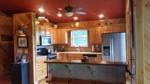 Large kitchen with  stainless steel appliances, ice maker, microwave, etc.