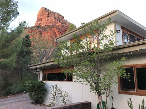 house and red rocks