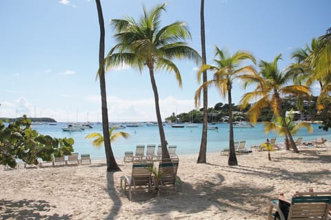 Beautiful white sandy beach with plenty of beach chairs.Less than a minute walk 