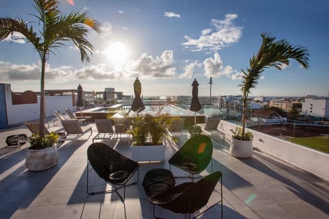 Condo rooftop with lounge area.