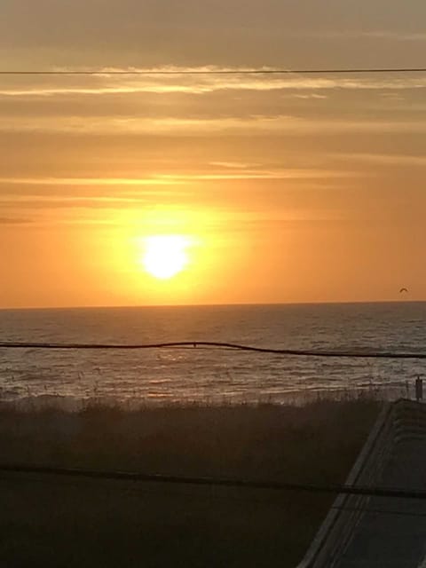 Awake to the view of the Ocean from this 2nd row Condo & sunset over the lake