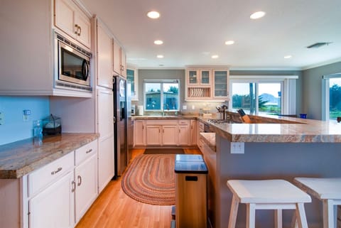 The kitchen with counter seating and well equipped for your cooking needs