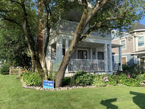 Lovely shady front porch and grassy lawn