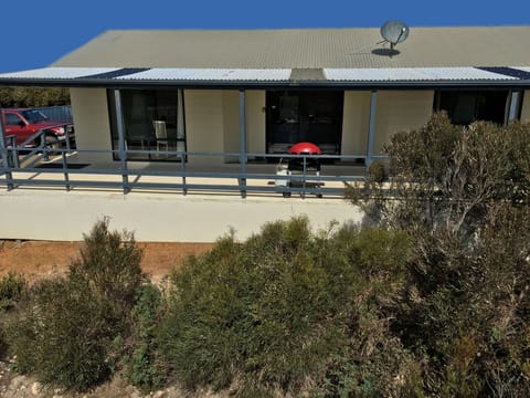 Front of Island Time including protected deck with BBQ