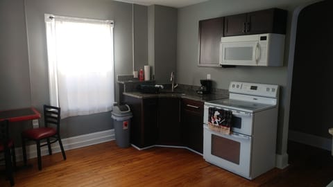 Kitchen with granite counters, double oven, new cabinets, hardwood floors