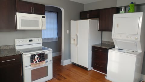 Kitchen with eat in table, laundry, coffee maker and appliances