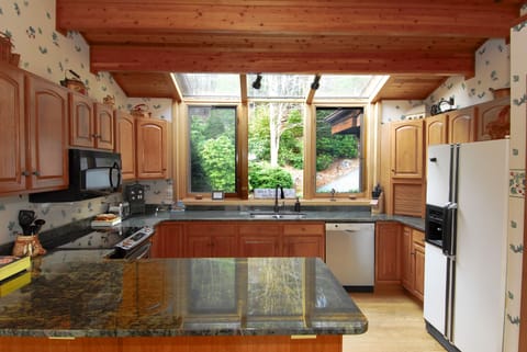Kitchen with granite counters and stainless steel appliances