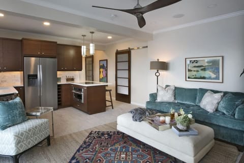 The lower suite`s private living room and full kitchen with AC.