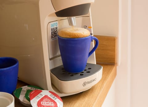 The kitchen has a coffee machine for you to enjoy.