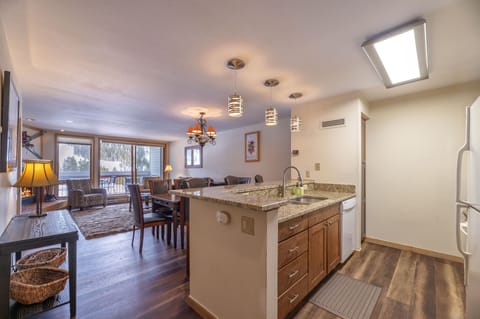 The 1st level has the kitchen, living room, deck, master bedroom, and Bath 1.