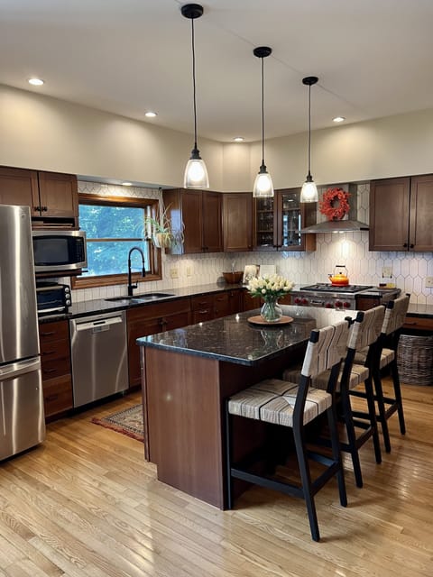 Fully equipped, updated kitchen with stainless steel including a Wolfe gas range