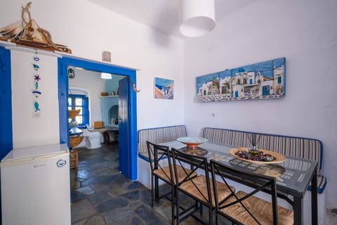 Main House dining area. Stella's artwork from locally salvaged materials.