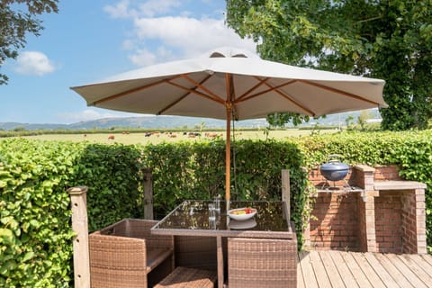 Outdoor seating with countryside and Mendip Hill views, perfect for relaxing