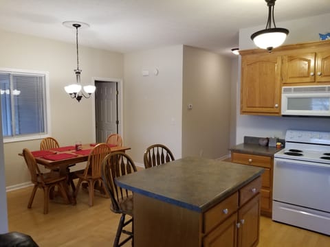 The kitchen is equipped with pots pans, coffee maker, dishes, silverware, etc.