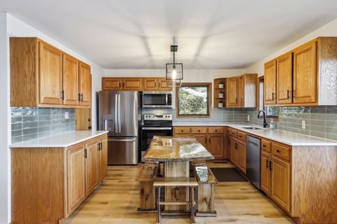 Upgraded stainless steel appliances, quartz countertops, custom tile backsplash.