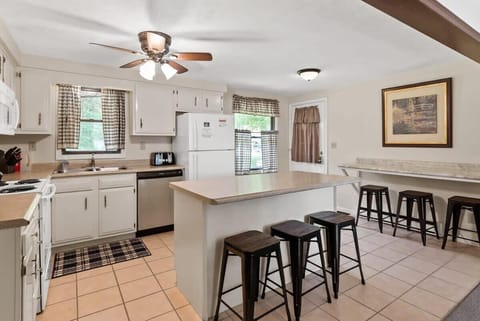The kitchen area of the Upper Scott Lake Retreat, complete with island and side counter seating. Want to set up your own small coffee bar? You've got room! What's for dinner? You get to decide!