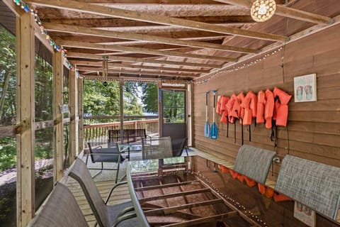 Relax in the Upper Scott Lake Retreat screened porch with the whole crew!