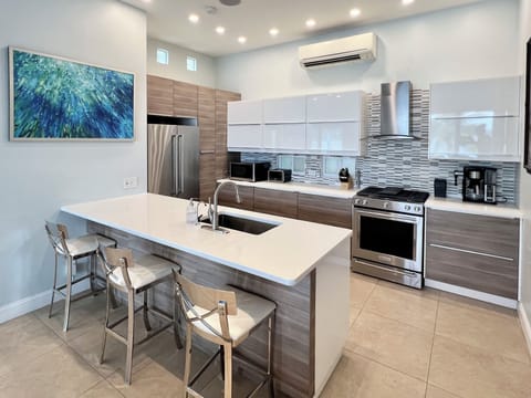 Chefs delight at this European-style kitchen, sleek design and hidden silverware