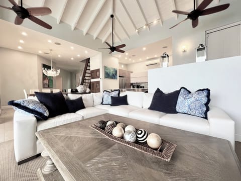 Spacious, bright living room, breathtaking oceanfront views with cozy seating.