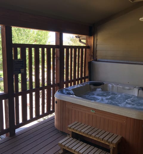 Private hot tub on back deck. Area also includes BBQ Grill.