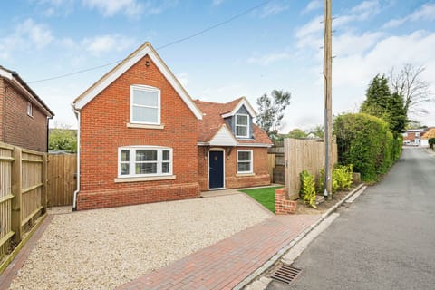 Front of house with parking for two cars