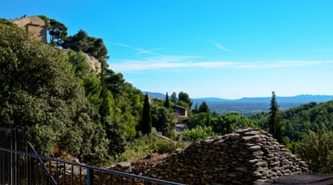 view from the swimming pool with beautiful ancient borie in foreground