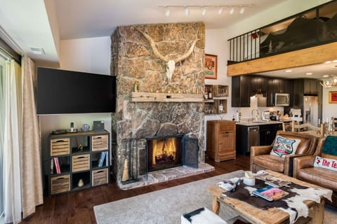 Living area with 72" flat screen TV