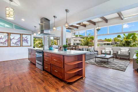 The open-concept floor plan connects the kitchen, dining, and living areas, making it easy to gather and enjoy time together.