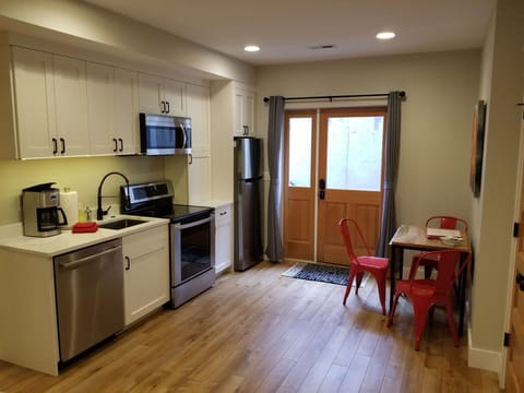Entry, kitchen, and dining area.