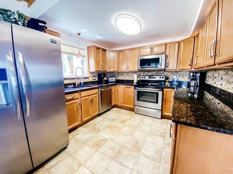 Kitchen with stainless appliances & lots of natural light.