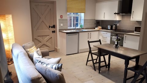 Bulmer apartment open plan kitchen, lounge, diner.