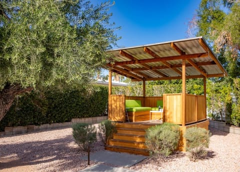 Raised custom pergola overlooks the pool and San Jacinto Mountains