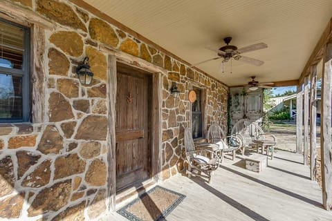 Even when the covered front porch isn't in shade, there are ceiling fans to keep the space cool!