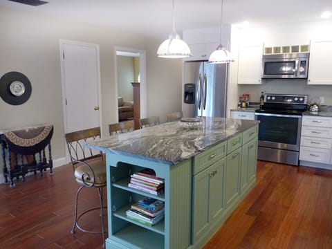 Updated Kitchen with Island and Bar Stools