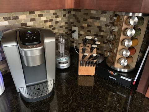 Coffee station with a variety of K-cups, and well equipped spice rack.    Everyt