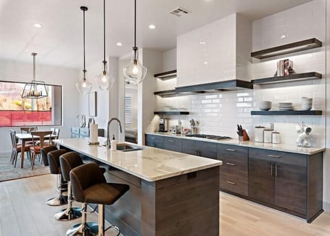 Deluxe kitchen stocked with appliances and cooking utensils