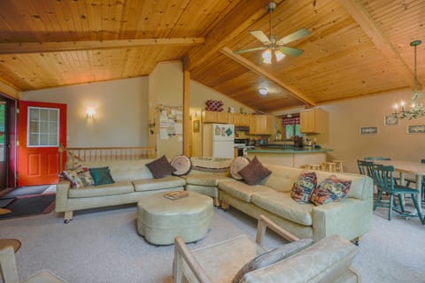 Upper family room-- facing steps to lower level/hallway to bedrooms & bathrooms