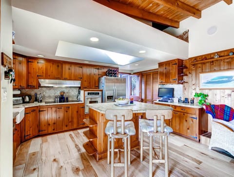 Kitchen area with original Knotty Pine cabinetry.