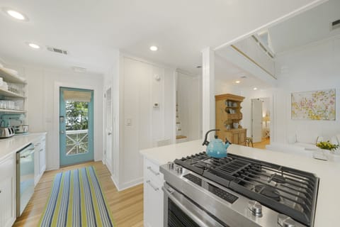 KITCHEN W/BUILT IN SHELVING AND SIDE PORCH ACCESS