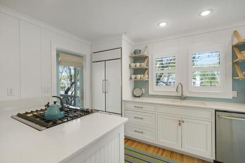 GAS BURNER STOVE AND LARGE SUB ZERO FRIDGE