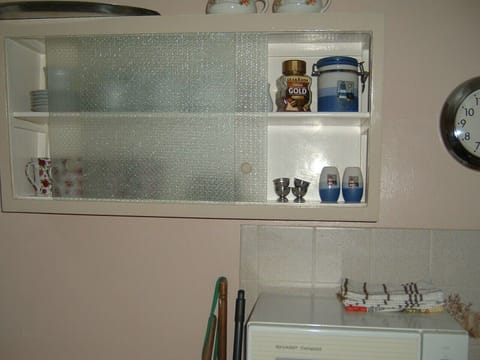 Kitchen with micro wave and equipment.