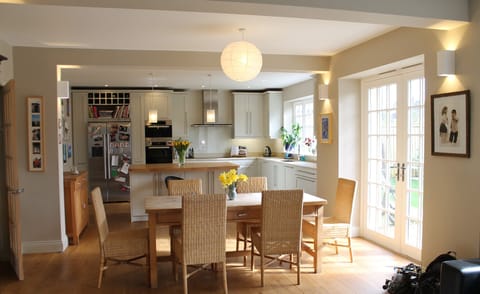 Large kitchen with double doors leading onto the garden.