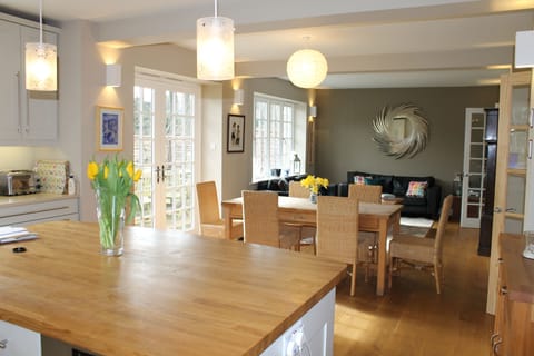 Large kitchen with table and sofa seating area.