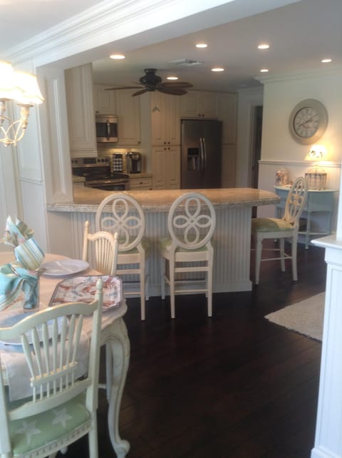 French inspired coastal dining area overlooking golf course and pool