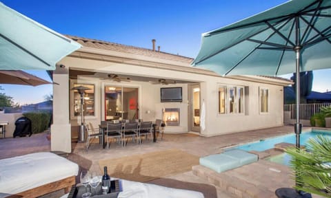 Backyard patio/entertainment area with fireplace and 54 inch flatscreen LG TV