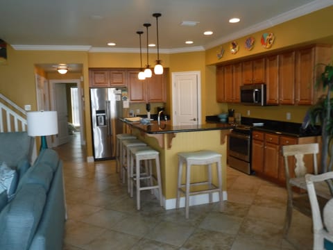 Fully stocked gourmet kitchen w/ granite and stainless appliances w/4 seat bar