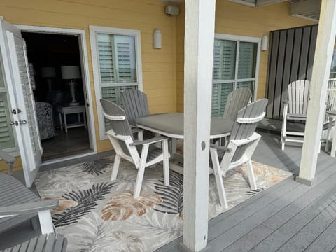 View from deck into den. Seating for 9-10 on deck with tables and lovely view.